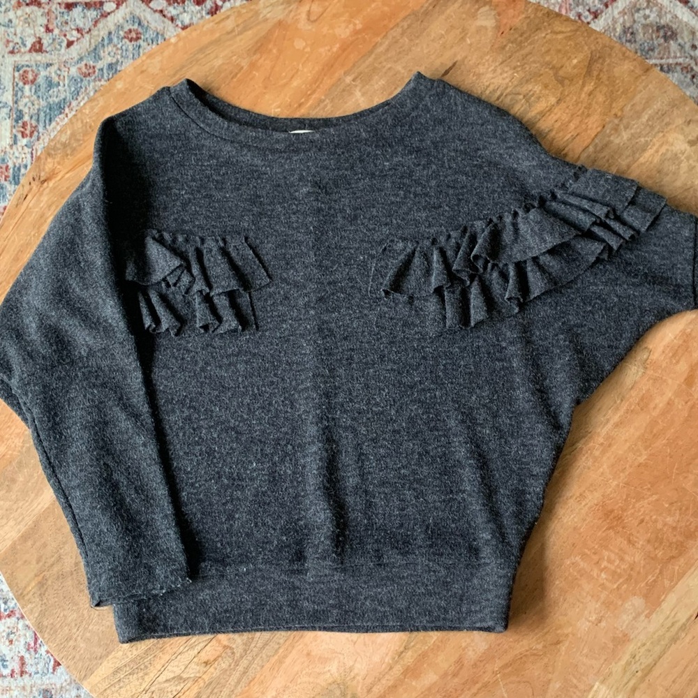 Gray sweater originally from a boutique.